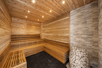 A dry sauna with wooden walls and benches